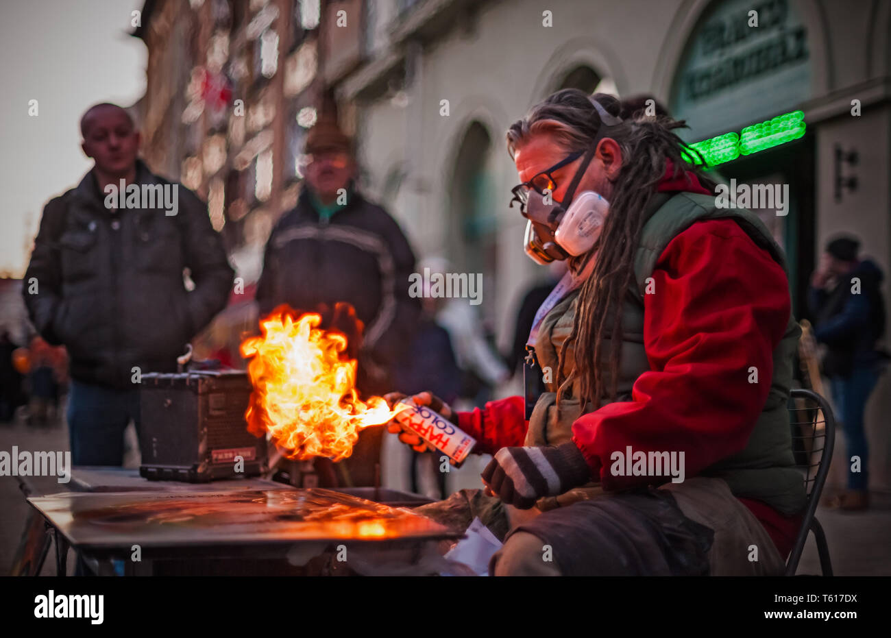Spray paint artist finishing his piece of art Stock Photo - Alamy
