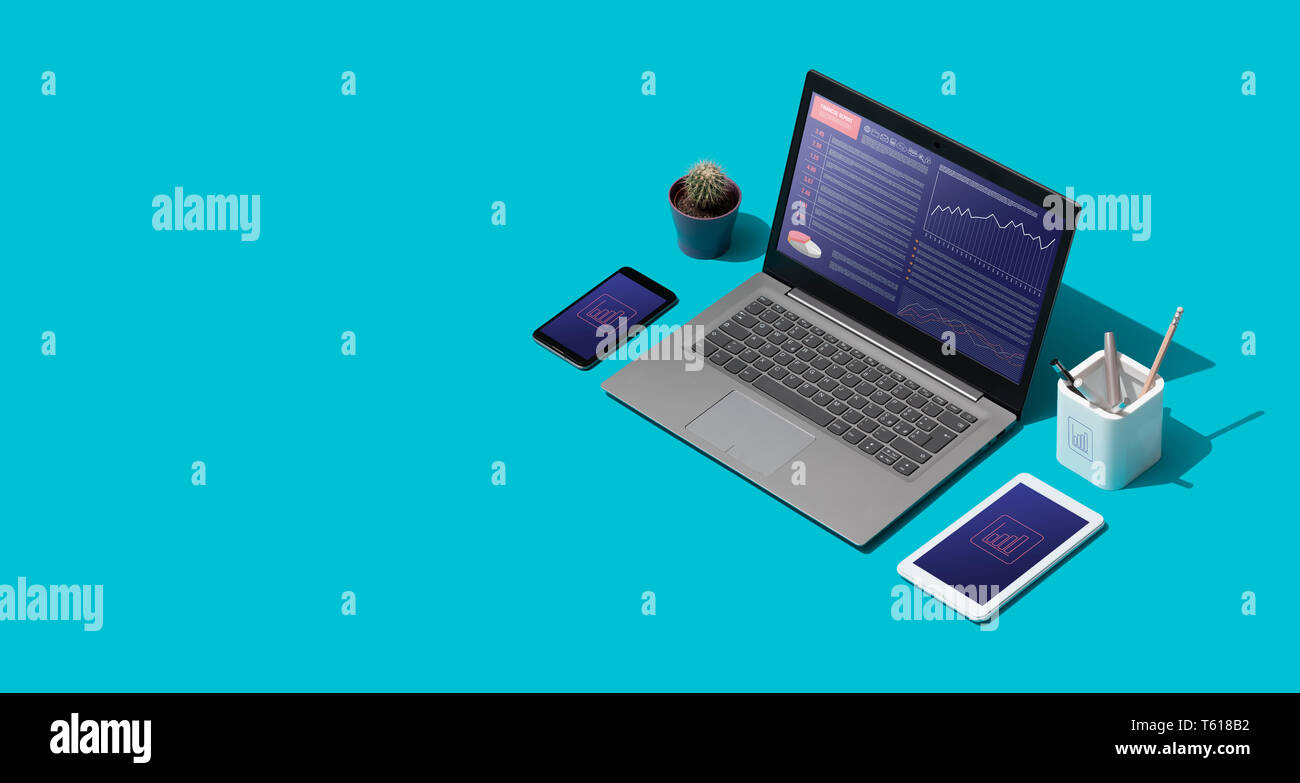 Contemporary corporate business desktop with laptop and isometric