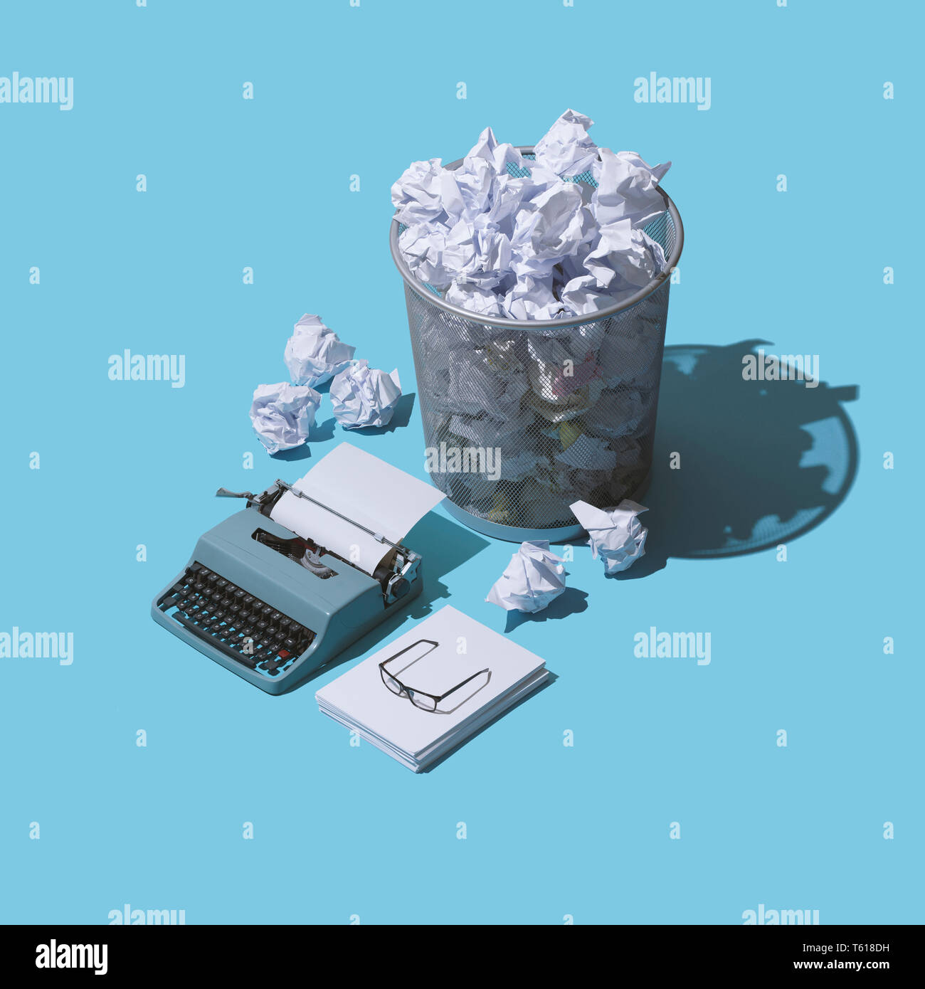 Fear or the blank page and lack of creativity: vintage typewriter with  blank sheet and lots of crumpled paper balls in a trash can Stock Photo -  Alamy