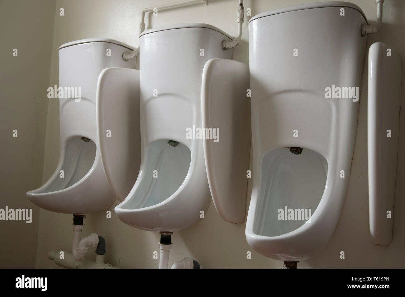 Urinals in an office building. Stock Photo