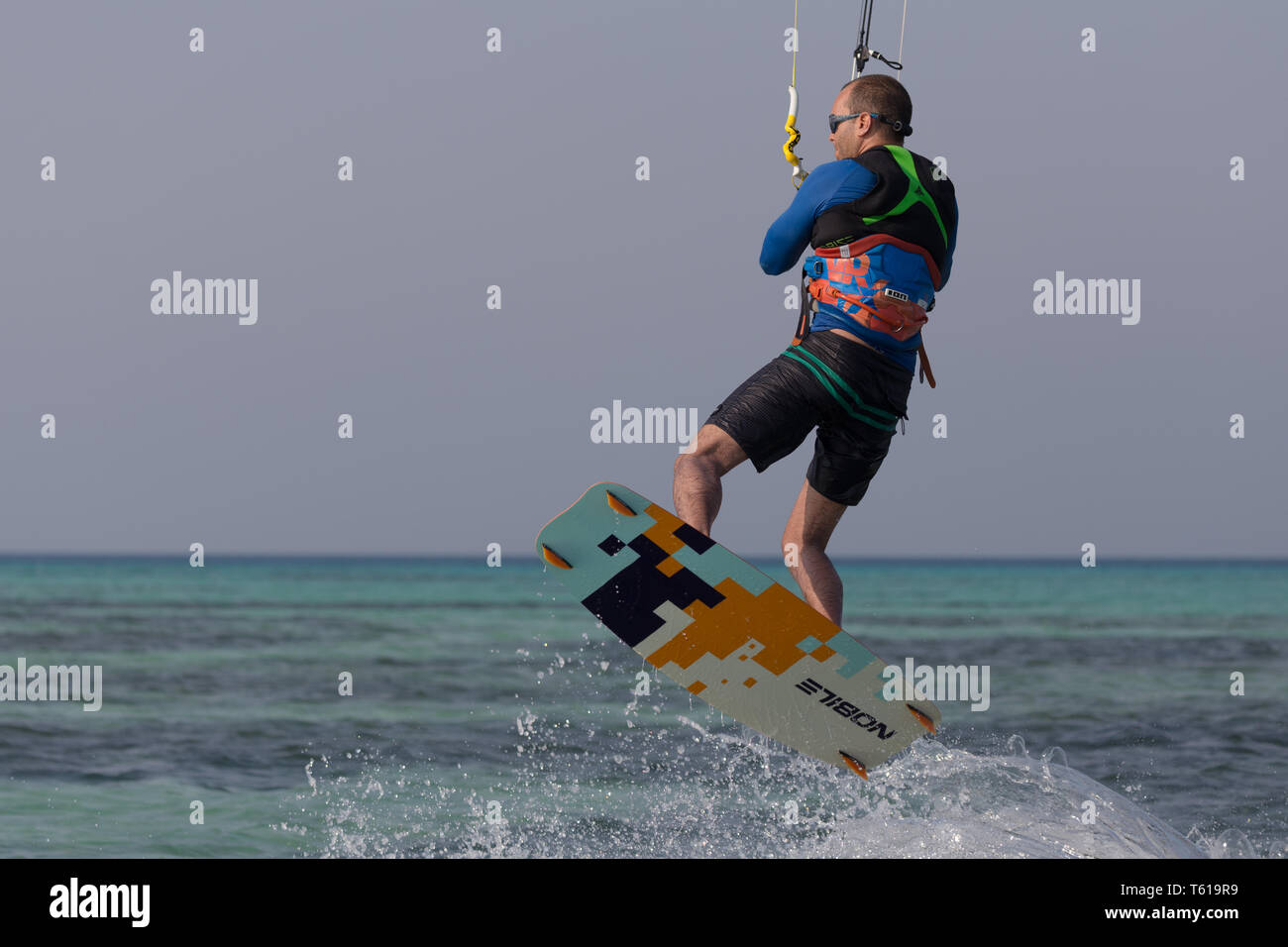 Kiteboarder jumping Stock Photo