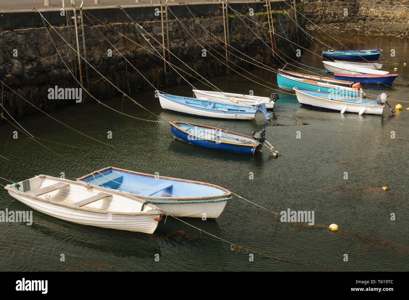 Rowing boats tied up in a harbour Stock Photo
