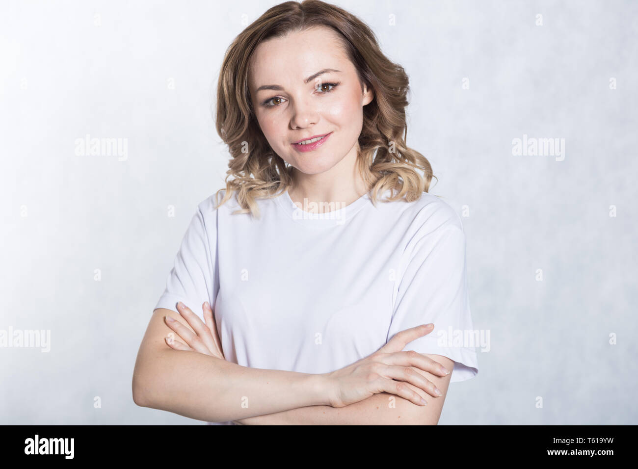 Portrait of a young smiling woman on a white background Stock Photo - Alamy