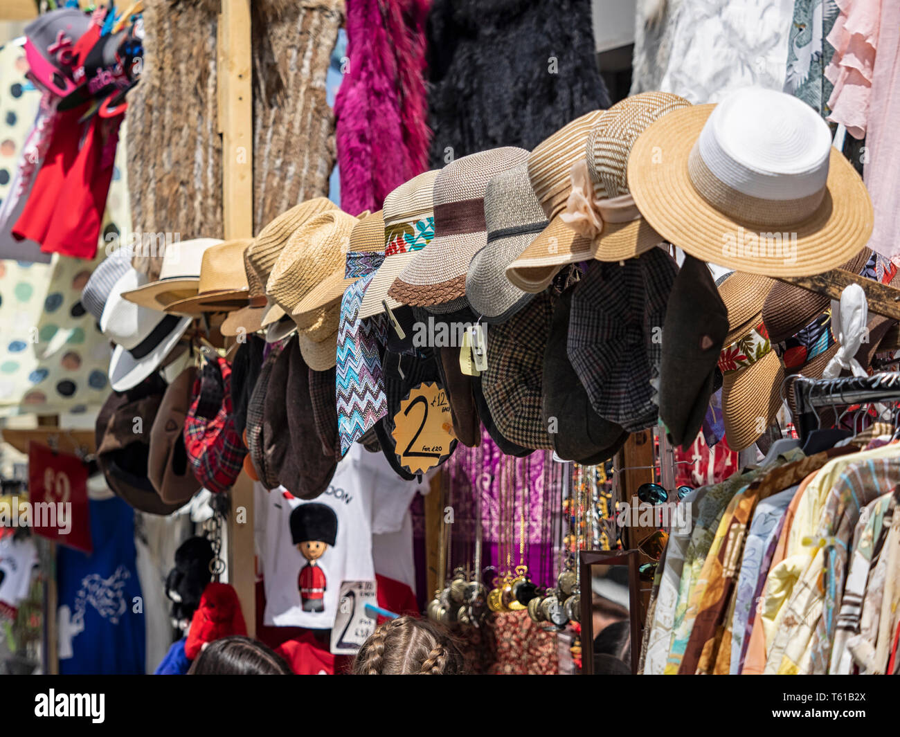 LONDON, UK - JUNE 14, 2018:  Hats and clothes for sale at Notting Hill Street Market Stock Photo