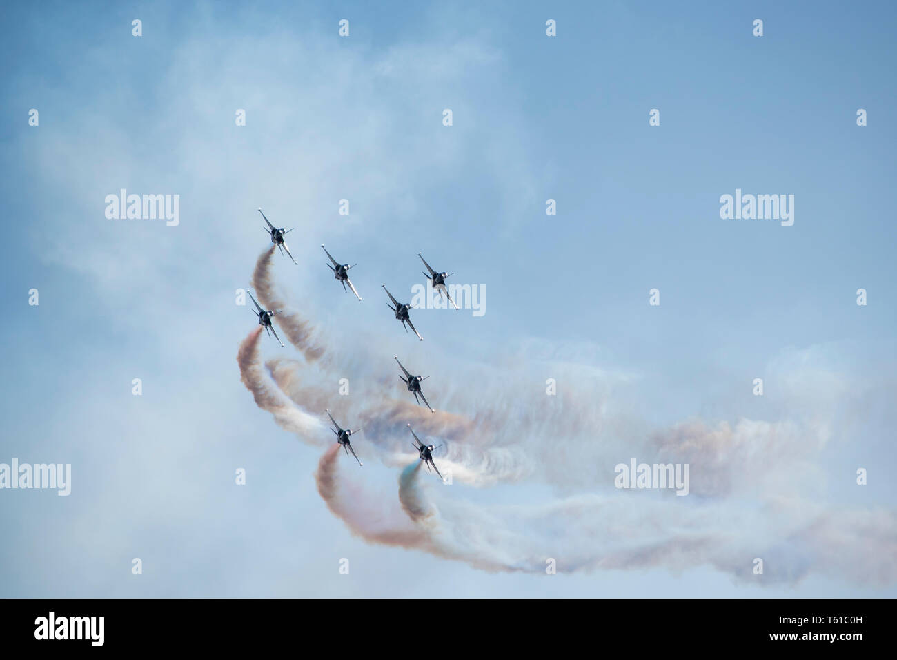 Airplane trails on blue sky with copy space. Stock Photo