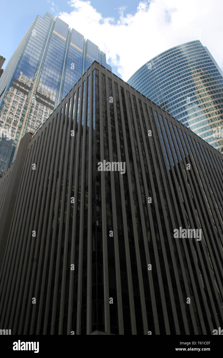 A Parking Garage And Two Modern Glass Skyscrapers Including Hyatt