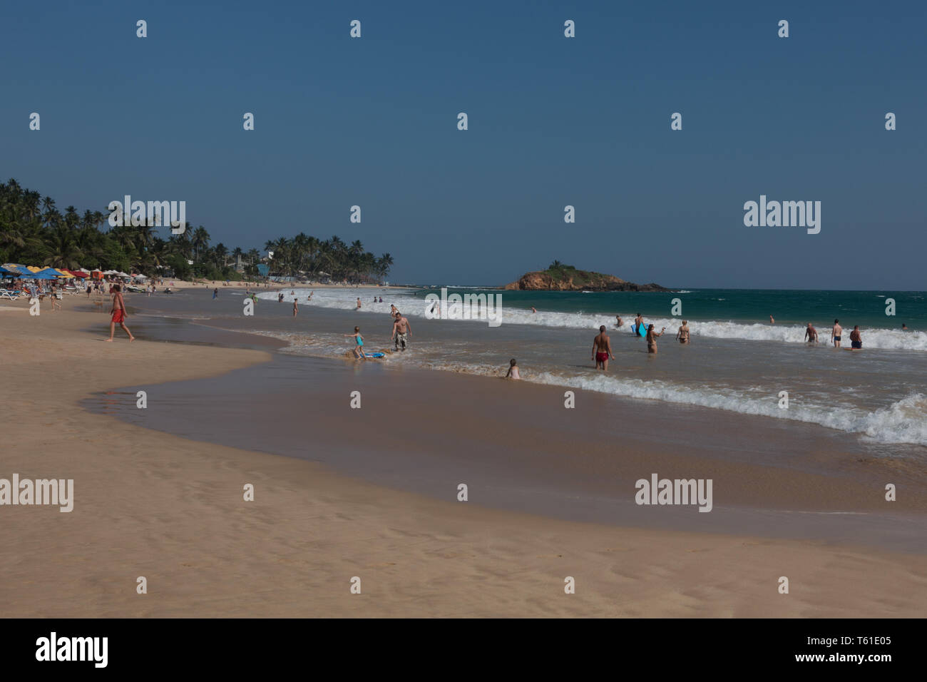 Bathers, Mirissa Beach, Sri Lanka. Stock Photo
