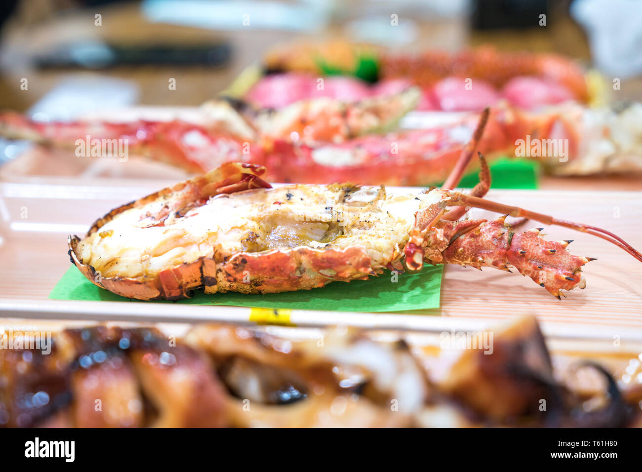 Focus and close up to grilled shrimp in Foam plate on the wood table. Stock Photo