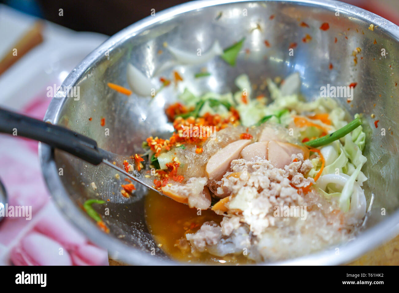 Cooking Thai traditional food called "Yam Woon Sen"; Glass Noodle,Pork