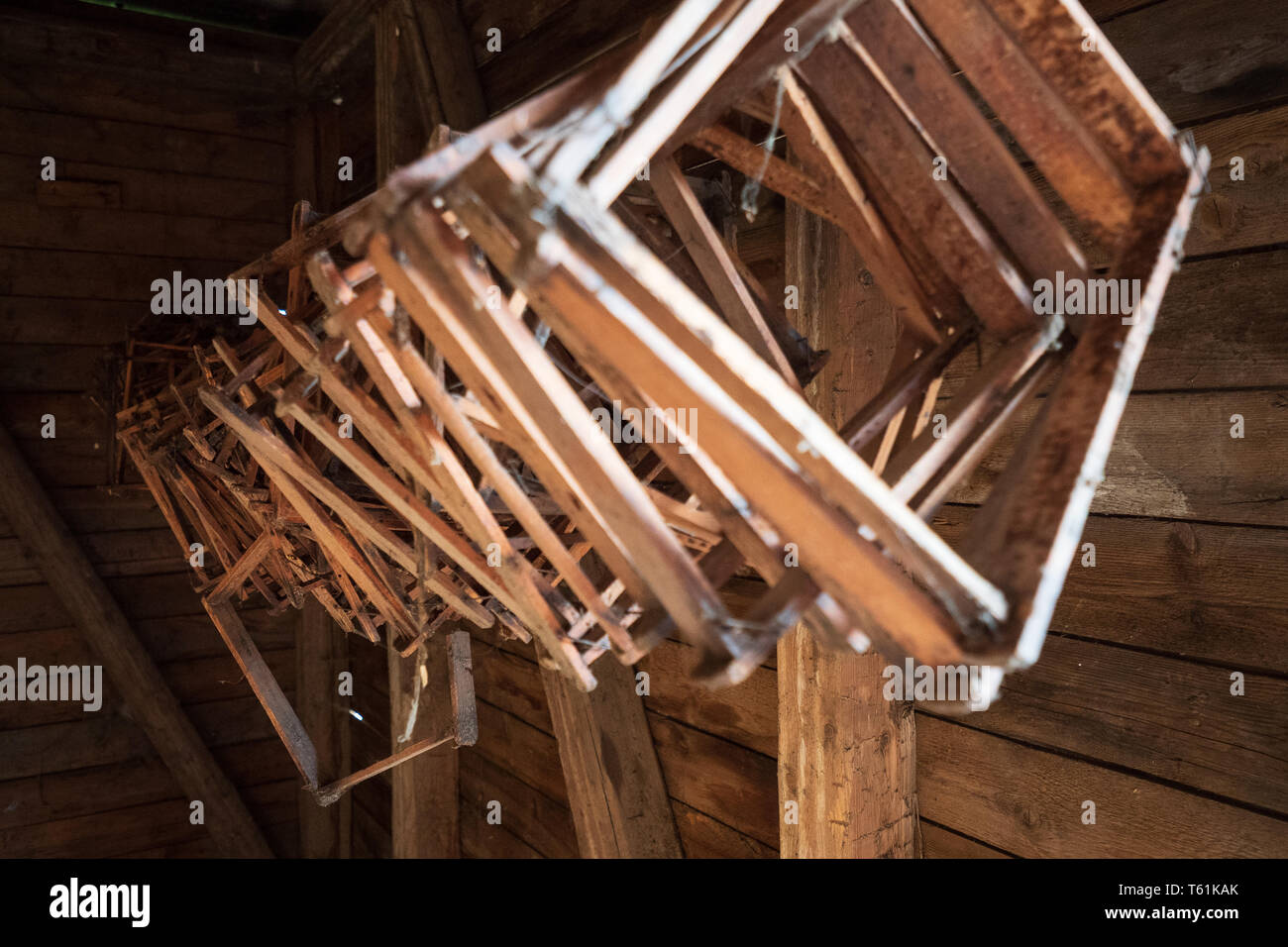 Wooden Honeycomb Frames Hanging From The Ceiling Of An Old Log
