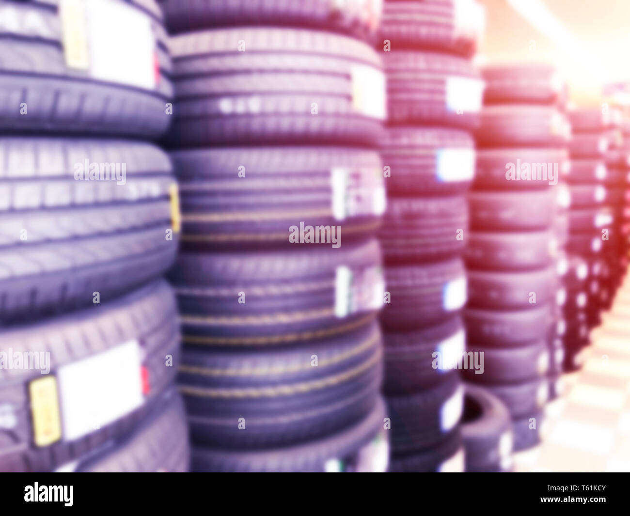 Abstract blurred background with car tires for sale. Blur photo of lots