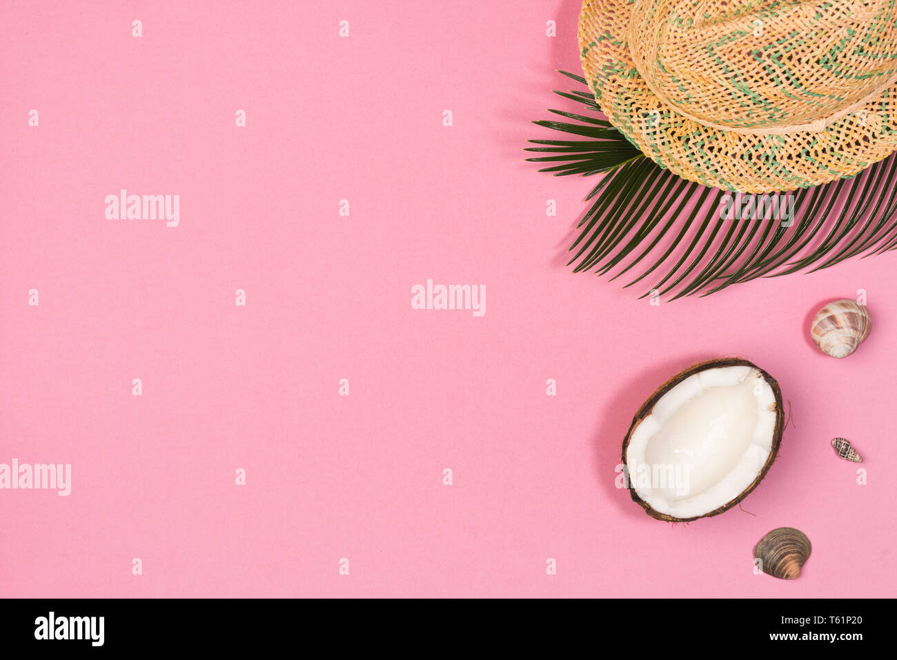 coconut, shells, hat, on a pink background top view Stock Photo - Alamy
