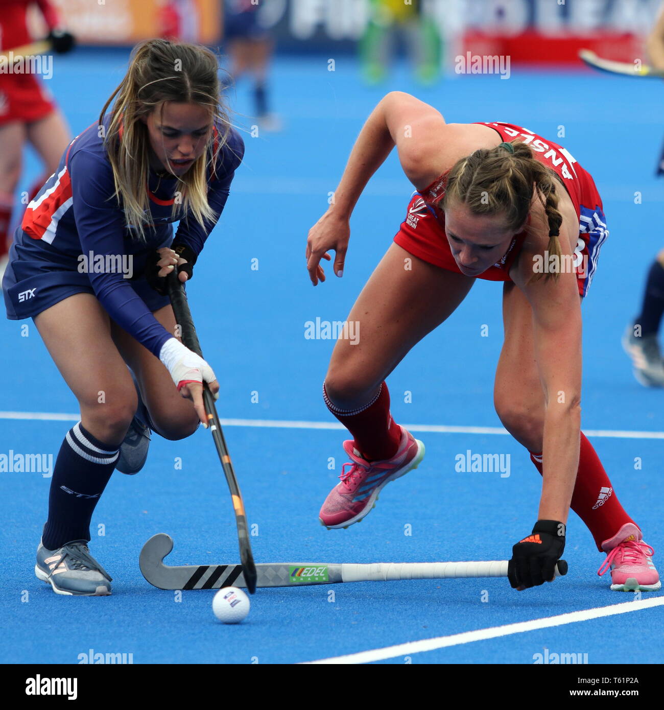 Giselle Ansley (GBR) and Amanda Magadan (USA) in the 2019 FIH Pro League Great Britain v United States women’s hockey match at Olympic Park, London Stock Photo