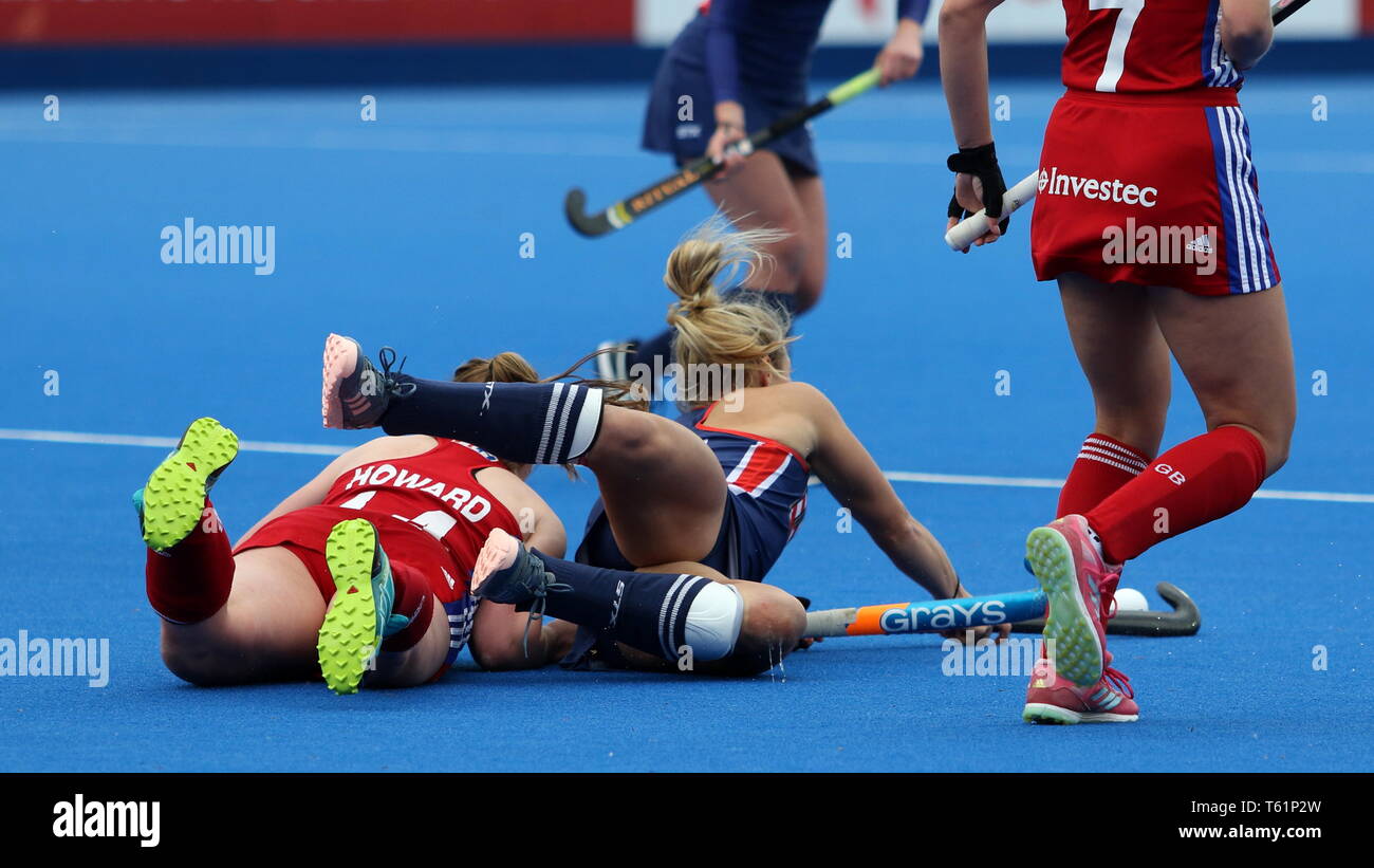 Players take a tumble in the 2019 FIH Pro League Great Britain v United States women’s hockey match at Queens Elizabeth Olympic Park, London. Stock Photo