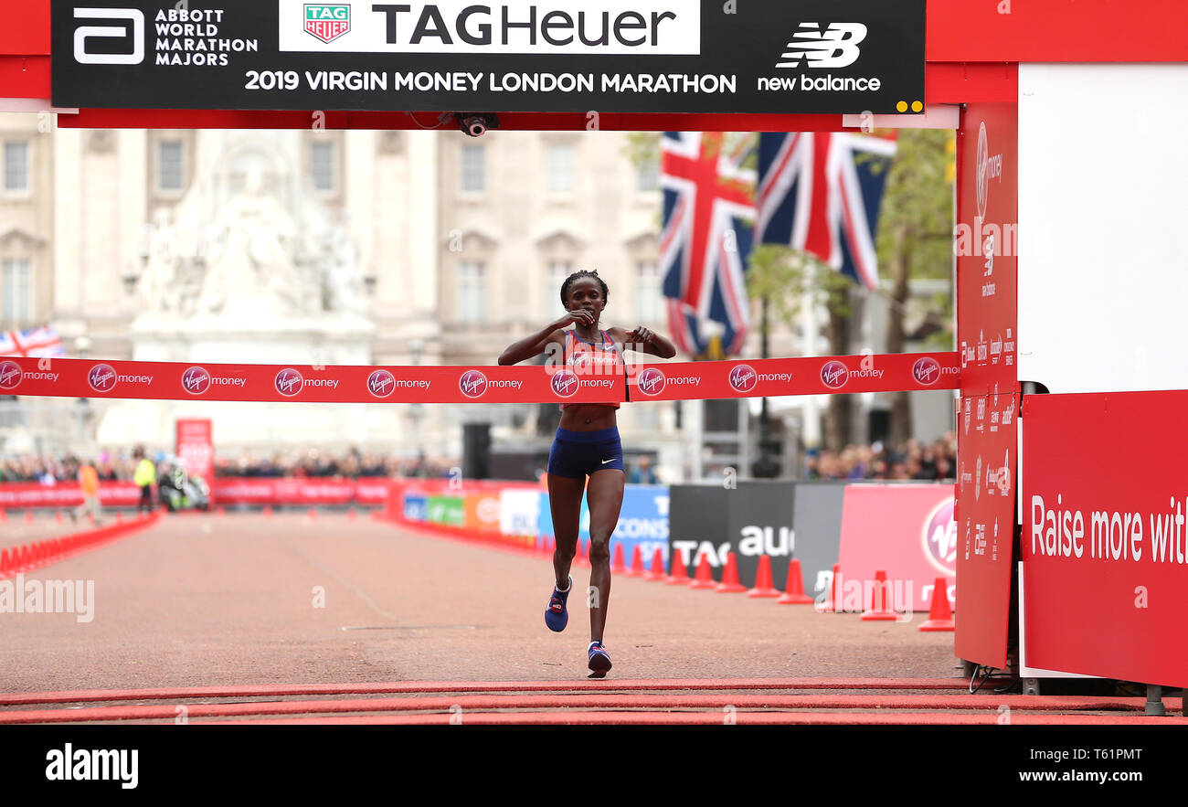 Kenya's Brigid Kosgei Crosses The Line To Win The Women's London ...