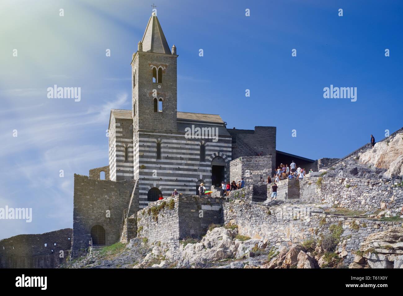 Portovenere, Italy- September 19 2018: Tourists visit the famous church located in the Cinque Terre of Liguria Stock Photo