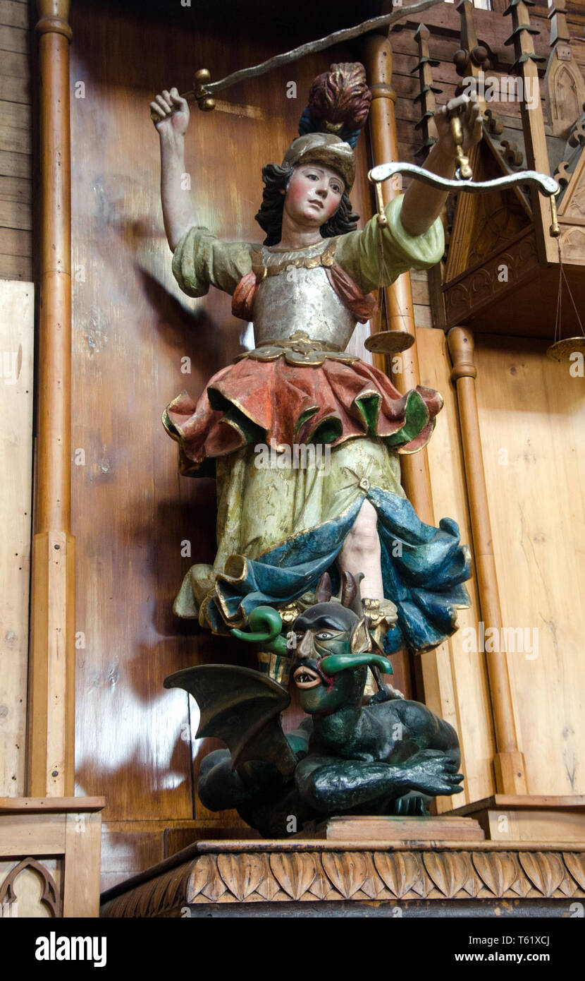 Inside Castro's main San Francisco church, on Chiloé island, is a shrine dedicated to Archangel.Michael victorious over a vivid Satan Stock Photo
