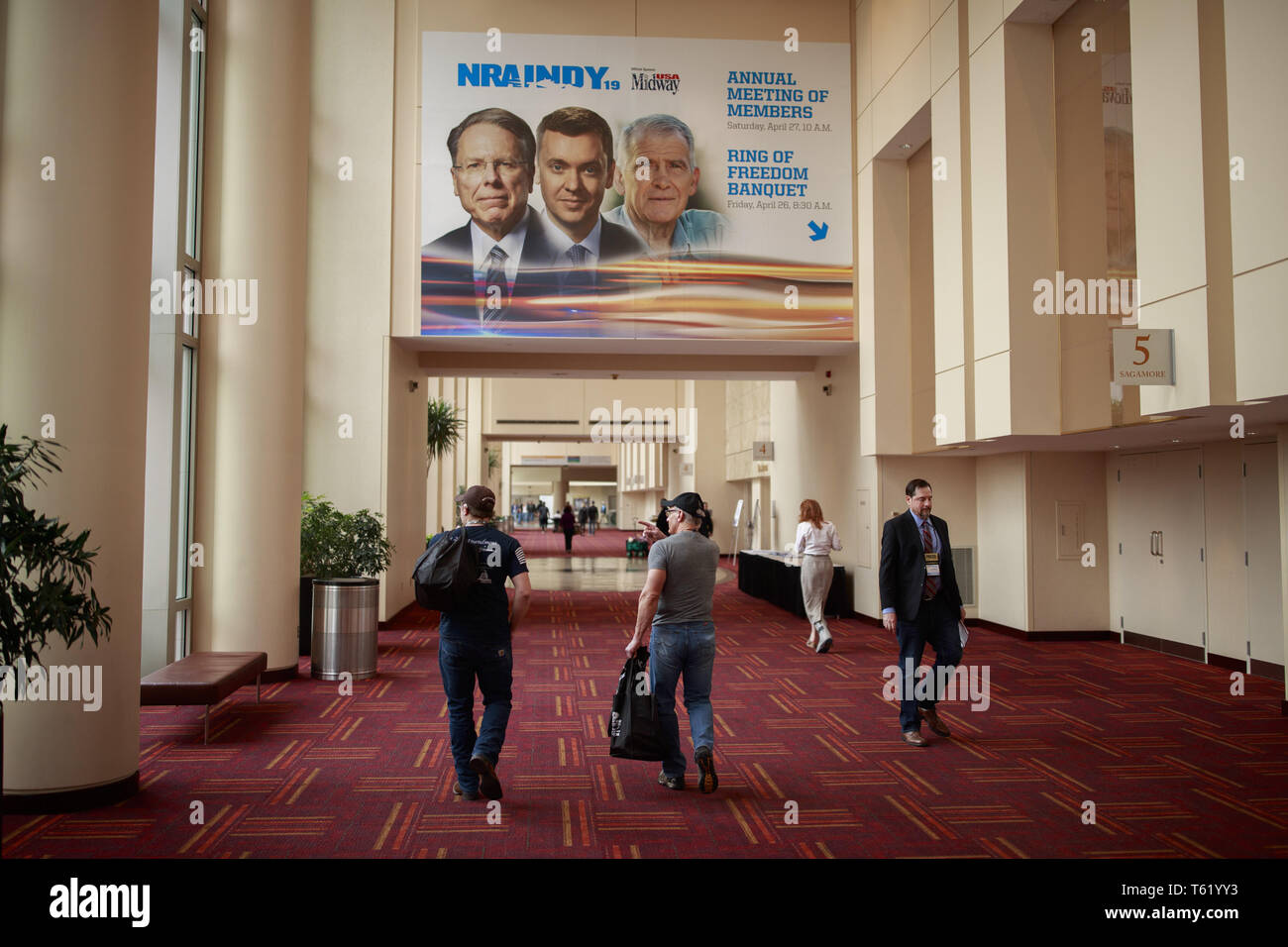 Indianapolis, Indiana, UK. 27th Apr, 2019. A photo of Chief Executive and Executive Vice President Wayne LaPierre, chief lobbyist and principal political strategist for the Institute for Legislative Action Chris Cox and former NRA president Oliver North, is displayed on the Indiana Convention Center during the third day of the National Rifle Association convention. Credit: Jeremy Hogan/SOPA Images/ZUMA Wire/Alamy Live News Stock Photo