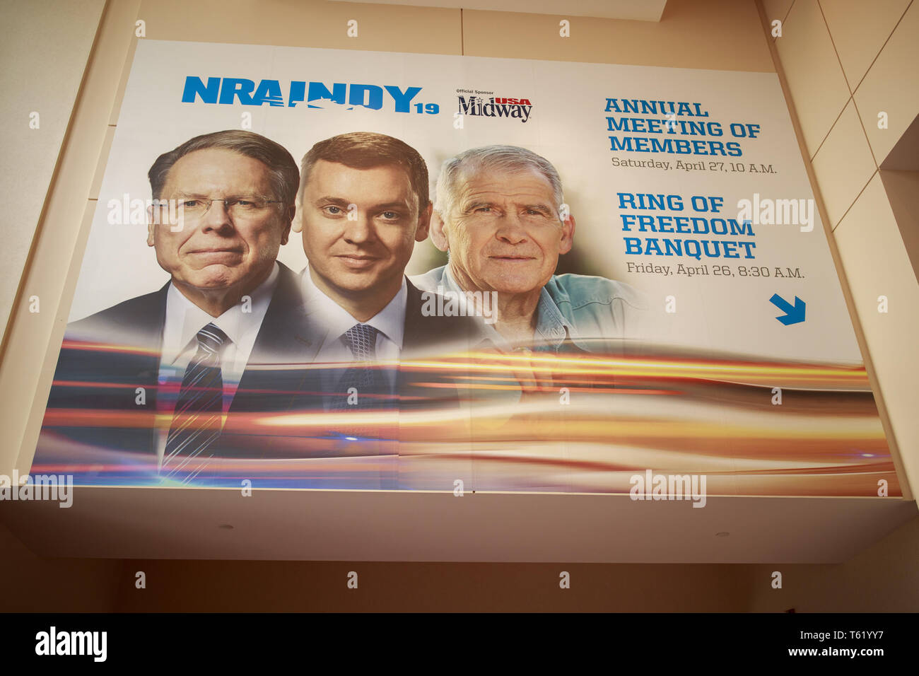 Indianapolis, Indiana, UK. 27th Apr, 2019. A photo of Chief Executive and Executive Vice President Wayne LaPierre, chief lobbyist and principal political strategist for the Institute for Legislative Action Chris Cox and former NRA president Oliver North, is displayed on the Indiana Convention Center during the third day of the National Rifle Association convention. Credit: Jeremy Hogan/SOPA Images/ZUMA Wire/Alamy Live News Stock Photo