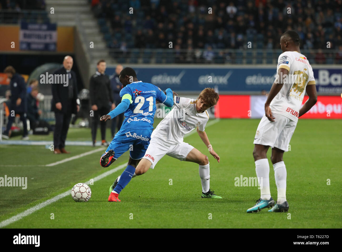 Gent, Belgium. 28th Apr, 2019. GENT, BELGIUM - APRIL 27: Nana Asare of Kaa Gent and Junya Ito of Genk fight for the ball during the Jupiler Pro League play-off 1 match (day 6) between Kaa Gent and Krc Genk on April 27, 2019 in Gent, Belgium. (Photo by Vincent Van Doornick/Isosport) Credit: Pro Shots/Alamy Live News Stock Photo