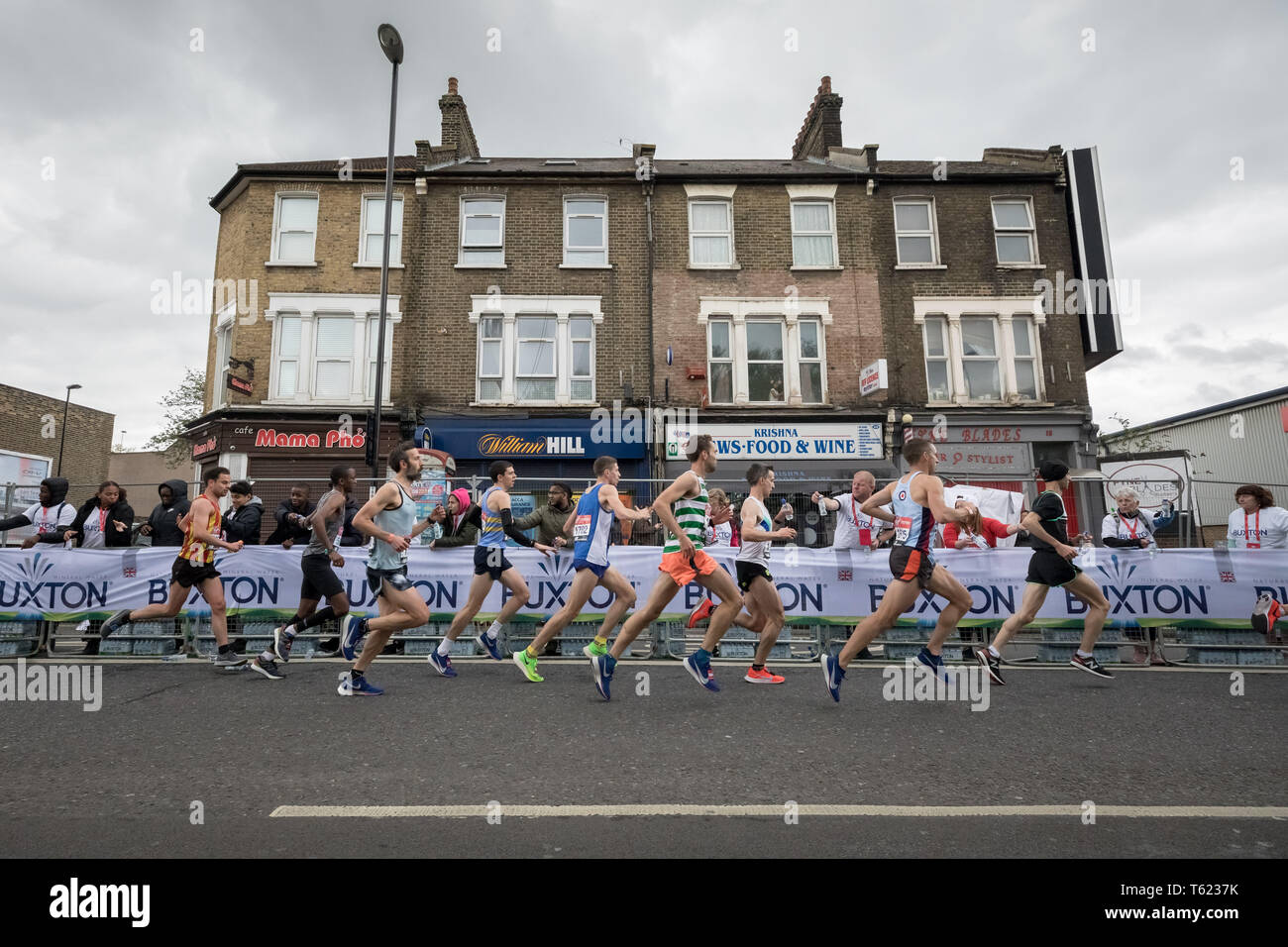 London, UK. 28th April, 2019. 39th London Marathon passes through Deptford’s Evelyn Street in South East London, also the 8 mile mark of the 26.2 mile course where runners are greeted and cheered on by local residents. Credit: Guy Corbishley/Alamy Live News Stock Photo