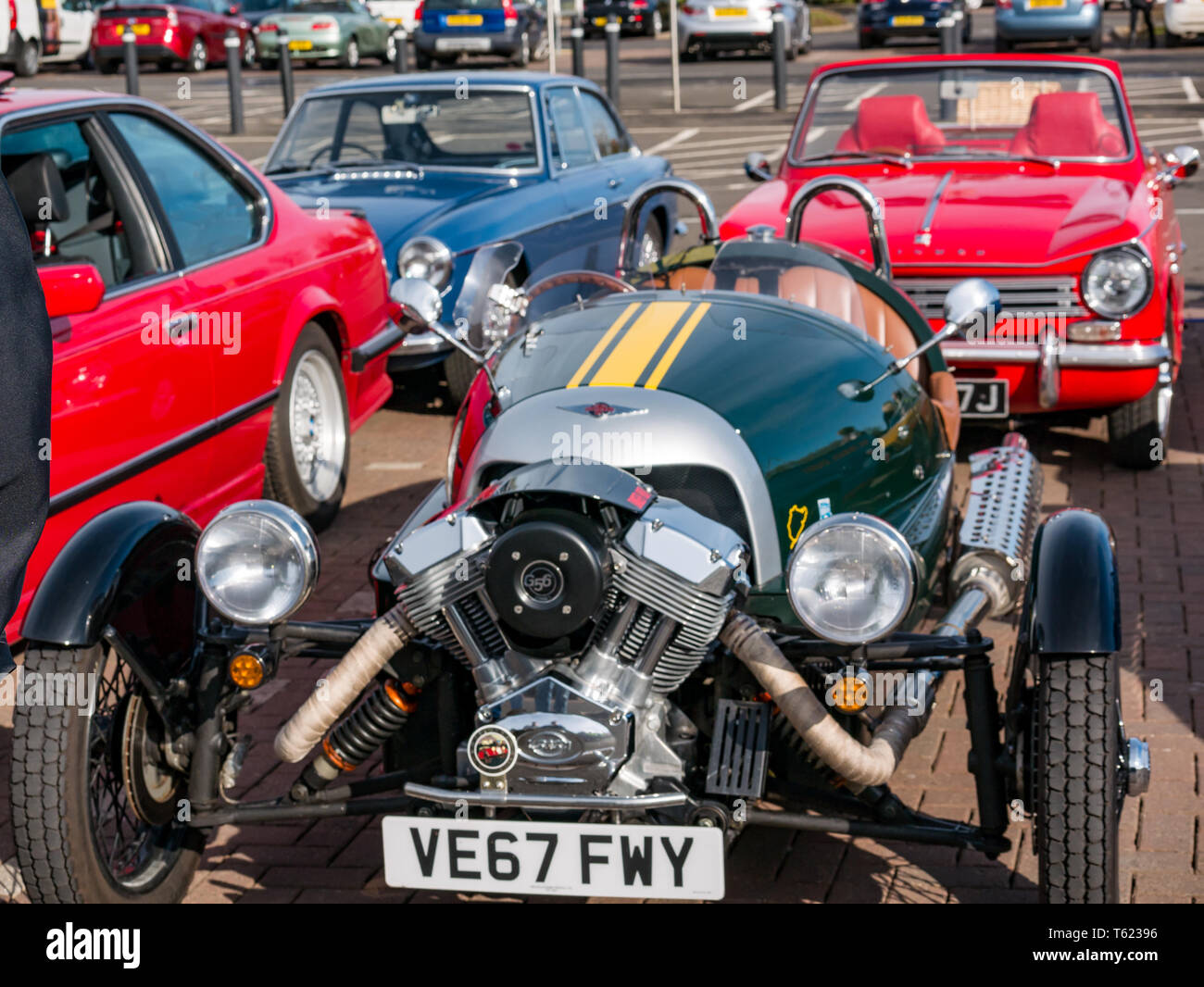 East Lothian, UK. 28 April 2019. Classic Car Tour: North Berwick Rotary Club holds its 3rd rally with 65 classic cars entered. The car rally route is from East Lothian and back through the Scottish Borders, raising money for local charities. The cars gather in North Berwick before setting off. A green 2017 Morgan three wheeler Stock Photo