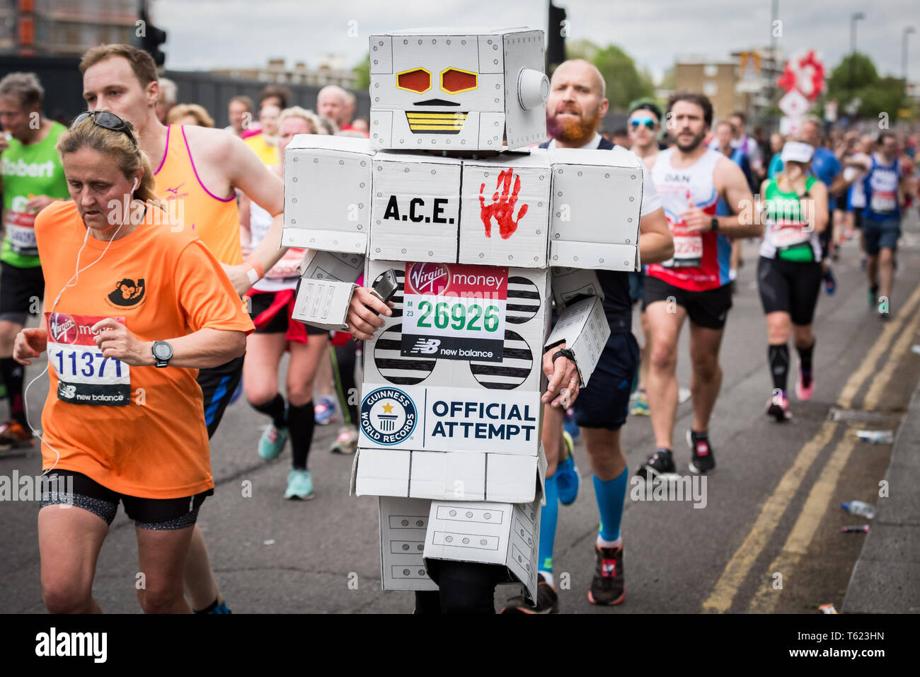 London, UK. 28th April, 2019. 39th London Marathon passes through Deptford’s Evelyn Street in South East London, also the 8 mile mark of the 26.2 mile course where runners are greeted and cheered on by local residents. Credit: Guy Corbishley/Alamy Live News Stock Photo