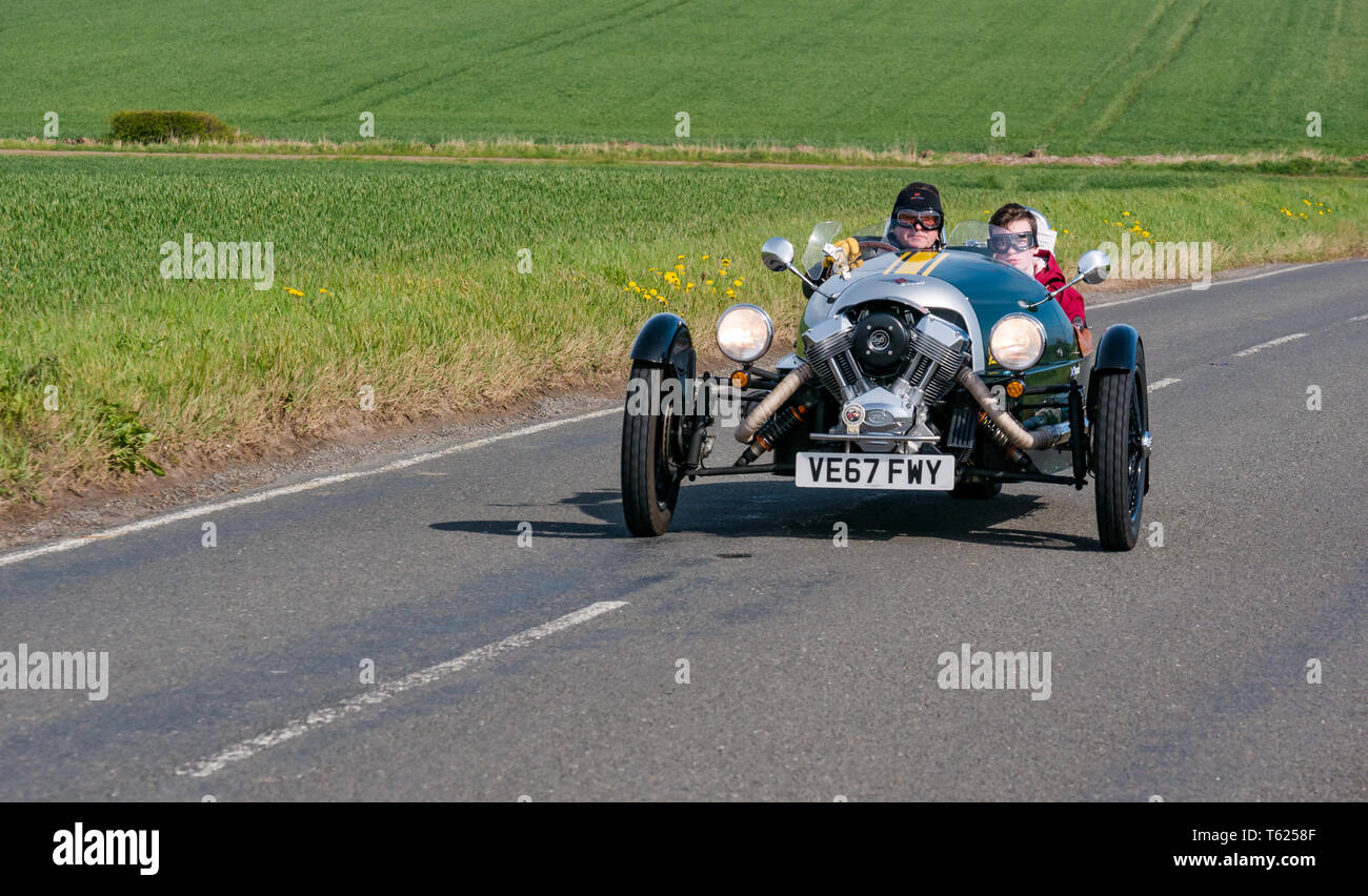 East Lothian, UK. 28 April 2019. Classic Car Tour: North Berwick Rotary Club holds its 3rd rally with 65 classic cars entered. The car rally route is from East Lothian and back through the Scottish Borders, raising money for local charities. A classic green 2017 Morgan three wheeled sports car Stock Photo