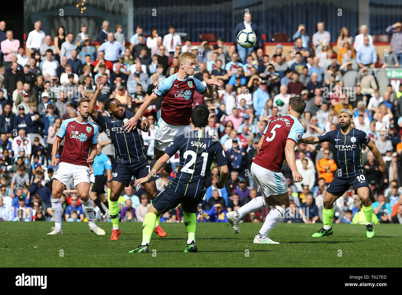 Burnley, UK. 28th Apr, 2019. Ben Mee of Burnley heads the ball clear. Premier League match, Burnley v Manchester City at Turf Moor in Burnley, Lancashire on Sunday 28th April 2019.  this image may only be used for Editorial purposes. Editorial use only, license required for commercial use. No use in betting, games or a single club/league/player publications. pic by Chris Stading/Andrew Orchard sports photography/Alamy Live news Credit: Andrew Orchard sports photography/Alamy Live News Stock Photo