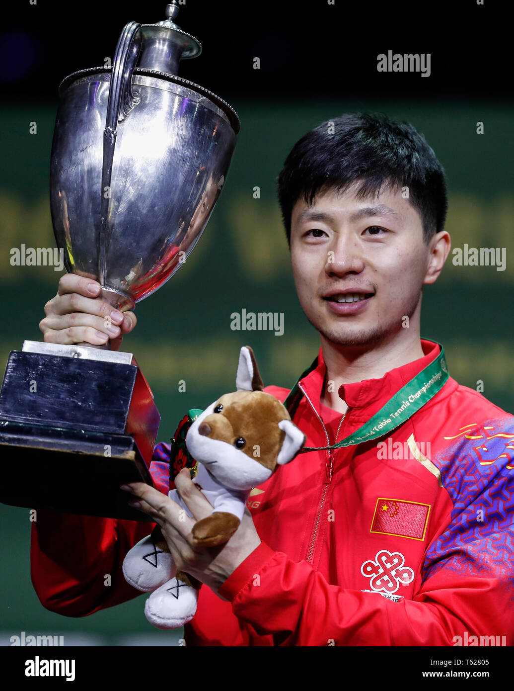 Budapest. 28th Apr, 2019. Ma Long of China poses with the trophy during