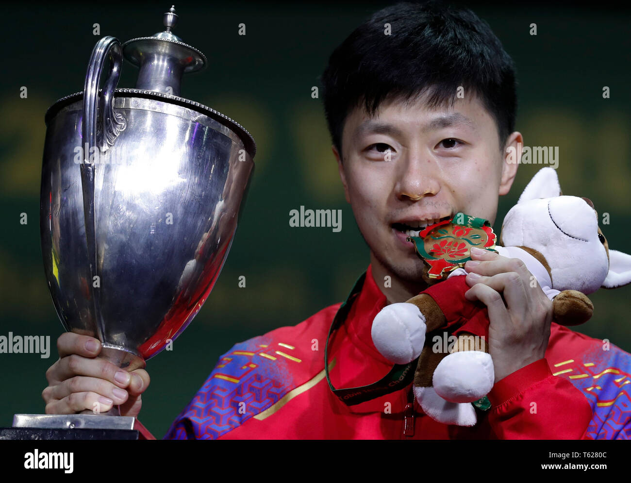 Budapest. 28th Apr, 2019. Ma Long of China poses with the trophy during