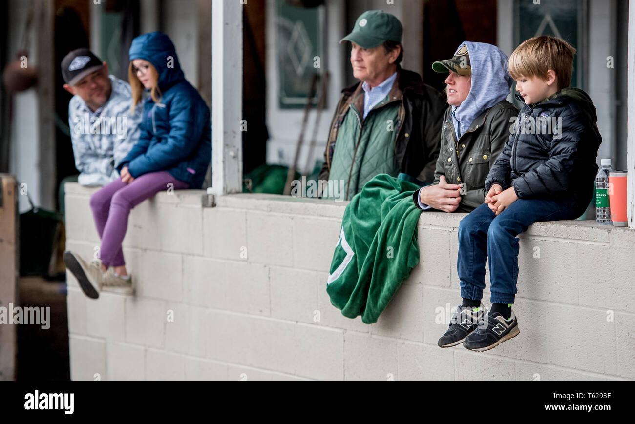 Louisville, Kentucky, USA. 28th Apr, 2019. LOUISVILLE, KENTUCKY - APRIL 28: Guiness and Olivia McFadden, on left, and Lisa and Tripp McFadden, on the right, watch as Country House, trained by William Mott, gets a bath after exercising in preparation for the Kentucky Derby at Churchill Downs in Louisville, Kentucky on April 28, 2019. The McFaddens, from Lexington, KY are part owners of the Derby prospect. Scott Serio/Eclipse Sportswire/CSM/Alamy Live News Stock Photo