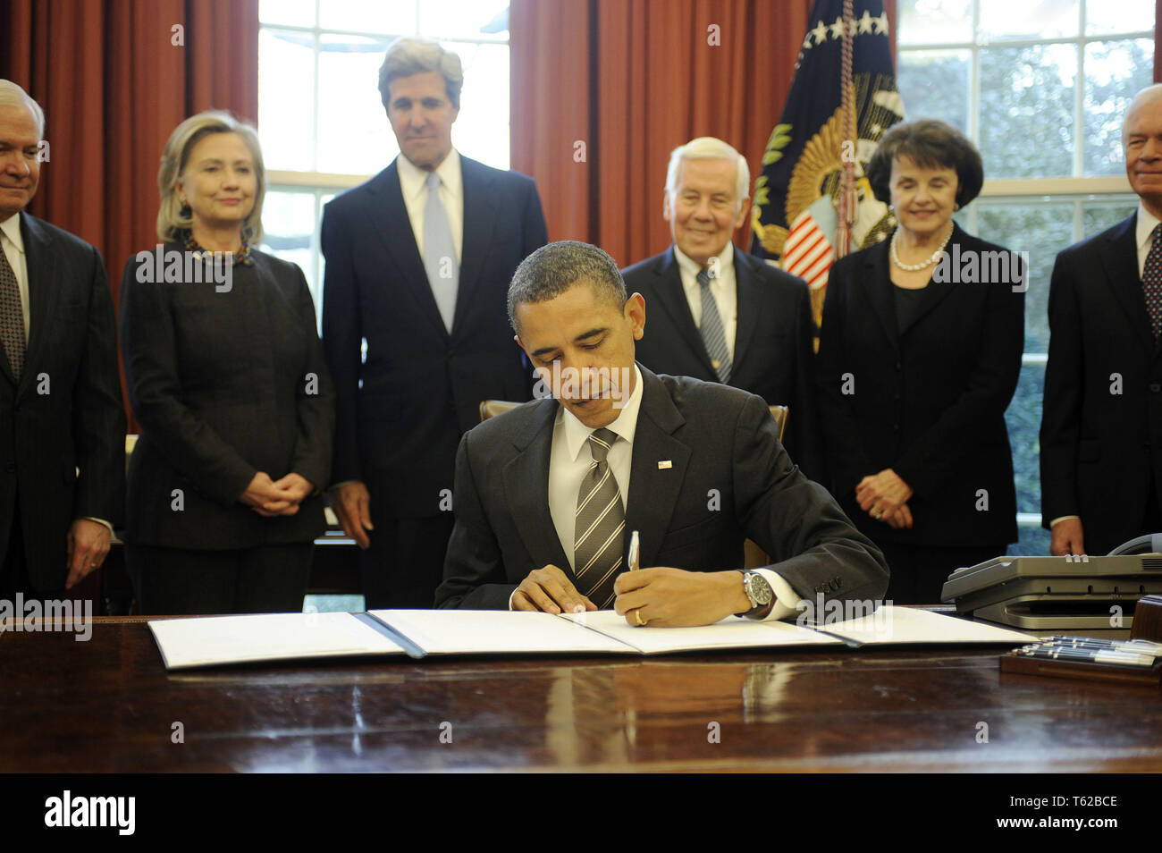 Washington, District of Columbia, USA. 2nd Feb, 2011. United States President Barack Obama signs the New START Treaty during a ceremony in the Oval Office of the White House, with, from left, U.S. Secretary of Defense Robert Gates, U.S. Secretary of State Hillary Rodham Clinton, U.S. Senator John Kerry (Democrat of Massachusetts), U.S. Senator Richard Lugar (Republican of Indiana), U.S. Senator Dianne Feinstein (Democrat of California), U.S. Senator Thad Cochran (Republican of Mississippi). Credit: Leslie E. Kossoff/Pool via CNP Credit: Leslie E. Kossoff/CNP/ZUMA Wire/Alamy Live News Stock Photo