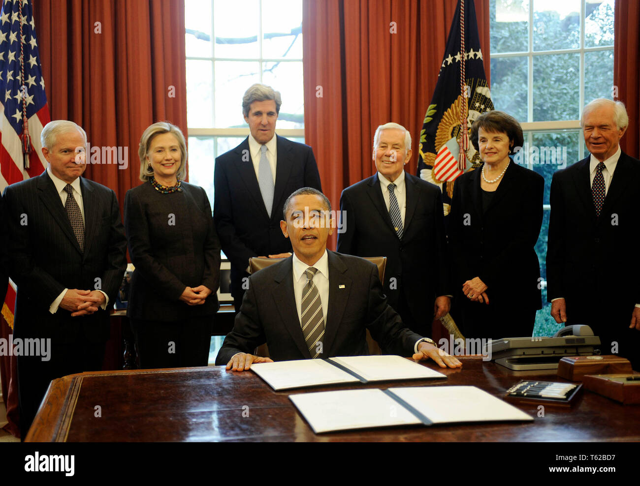 Washington, United States Of America. 02nd Feb, 2011. United States President Barack Obama signs the New START Treaty during a ceremony in the Oval Office of the White House, with, from left, U.S. Secretary of Defense Robert Gates, U.S. Secretary of State Hillary Rodham Clinton, U.S. Senator John Kerry (Democrat of Massachusetts), U.S. Senator Richard Lugar (Republican of Indiana), U.S. Senator Dianne Feinstein (Democrat of California), U.S. Senator Thad Cochran (Republican of Mississippi). Credit: Leslie E. Kossoff/Pool via CNP | usage worldwide Credit: dpa/Alamy Live News Stock Photo