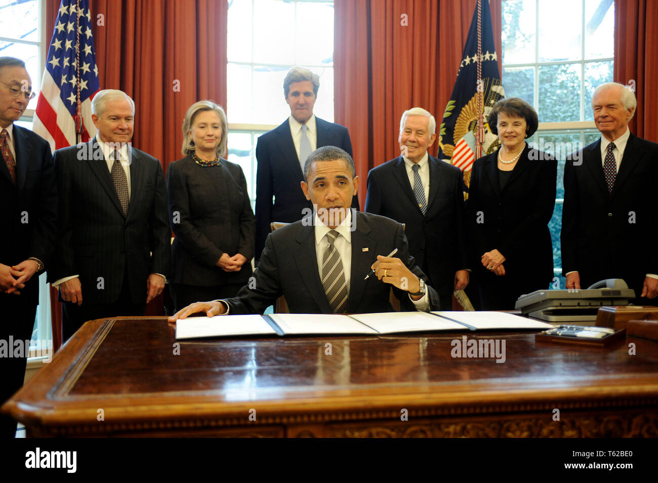 United States President Barack Obama signs the New START Treaty during a ceremony in the Oval Office of the White House, with, from left, U.S. Secretary of Energy Steven Chu, U.S. Secretary of Defense Robert Gates, U.S. Secretary of State Hillary Rodham Clinton, U.S. Senator John Kerry (Democrat of Massachusetts), U.S. Senator Richard Lugar (Republican of Indiana), U.S. Senator Dianne Feinstein (Democrat of California), and U.S. Senator Thad Cochran (Republican of Mississippi).Credit: Leslie E. Kossoff/Pool via CNP | usage worldwide Stock Photo