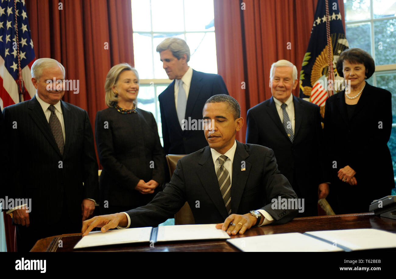 Washington, United States Of America. 02nd Feb, 2011. United States President Barack Obama signs the New START Treaty during a ceremony in the Oval Office of the White House, with, from left, U.S. Secretary of Defense Robert Gates, U.S. Secretary of State Hillary Rodham Clinton, U.S. Senator John Kerry (Democrat of Massachusetts), U.S. Senator Richard Lugar (Republican of Indiana), U.S. Senator Dianne Feinstein (Democrat of California). Credit: Leslie E. Kossoff/Pool via CNP | usage worldwide Credit: dpa/Alamy Live News Stock Photo