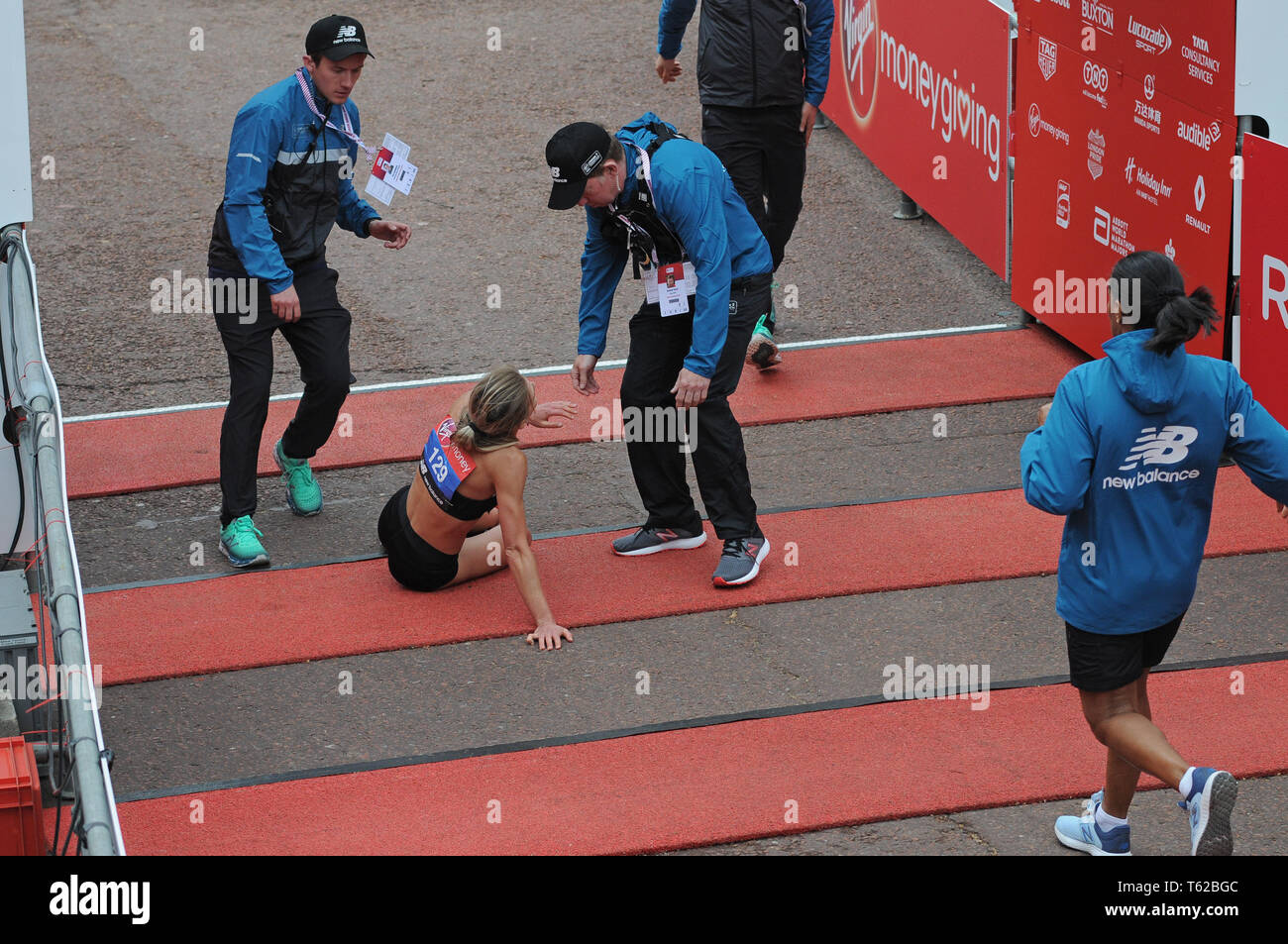 London, UK. 28th Apr, 2019. Hayley Carruthers GB elite women runner collapses at finish line of
