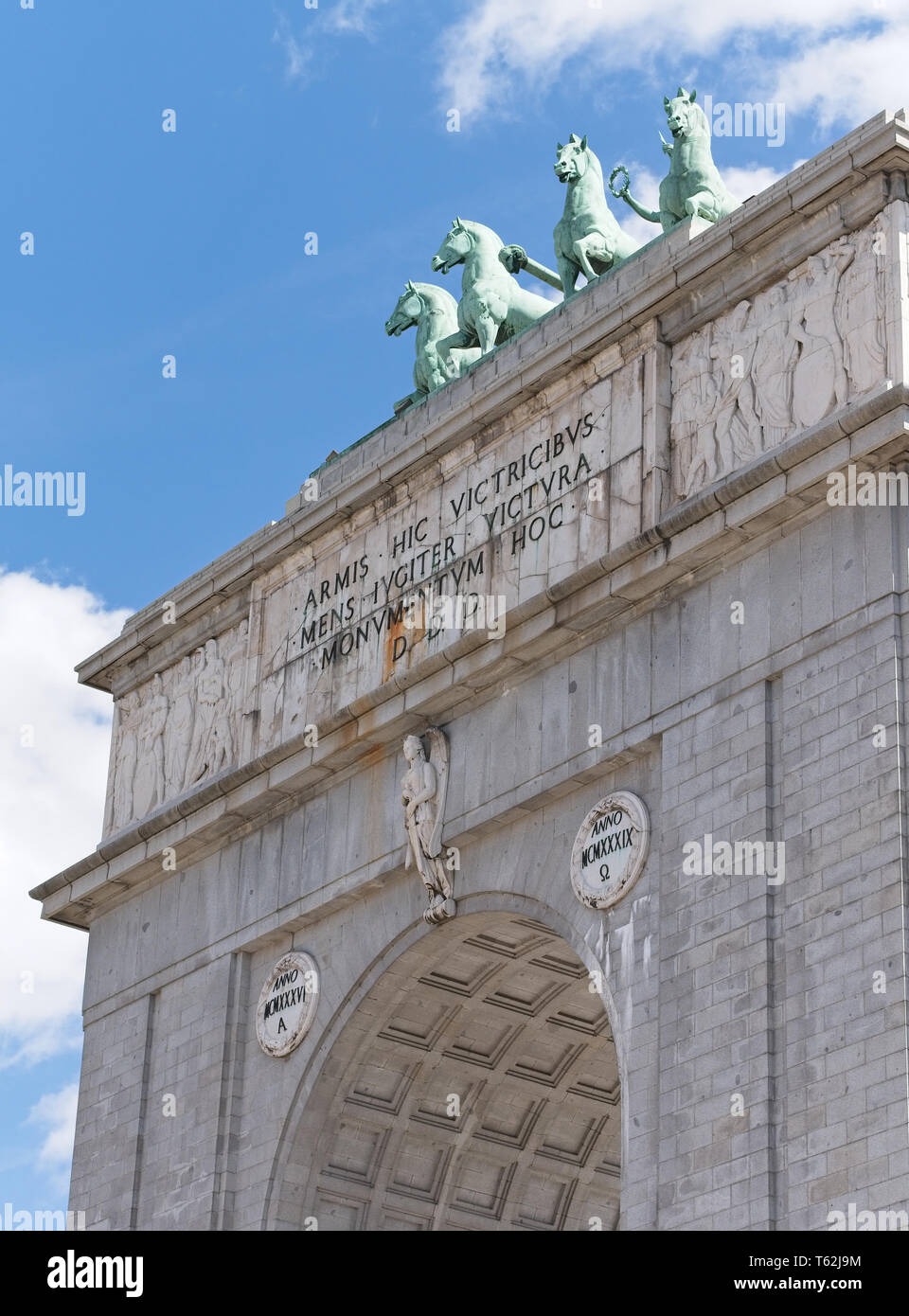 Arco de la Victoria (Victory Arch) is a triumphal arch built in the Moncloa, Madrid, Spain. Stock Photo