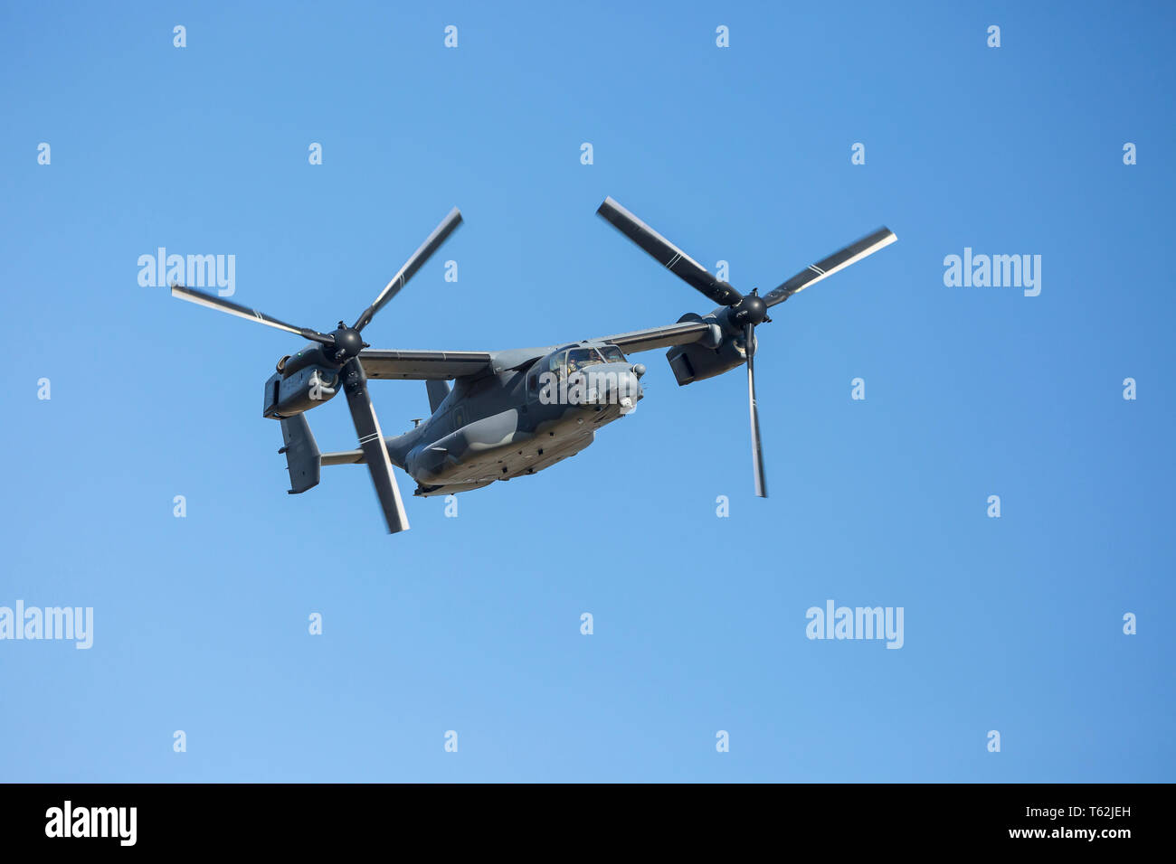 Close up of the American multi-mission Bell Boeing V-22 Osprey, a tilt-rotor military aircraft, in flight over the Mach Loop, Wales, UK. Stock Photo