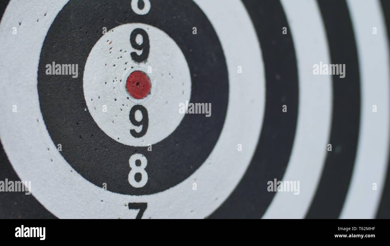 hitting bull's eye, single shot bulls-eye. Concept of successful business ideas hitting the exact center of the target. Perfect performance of the Stock Photo