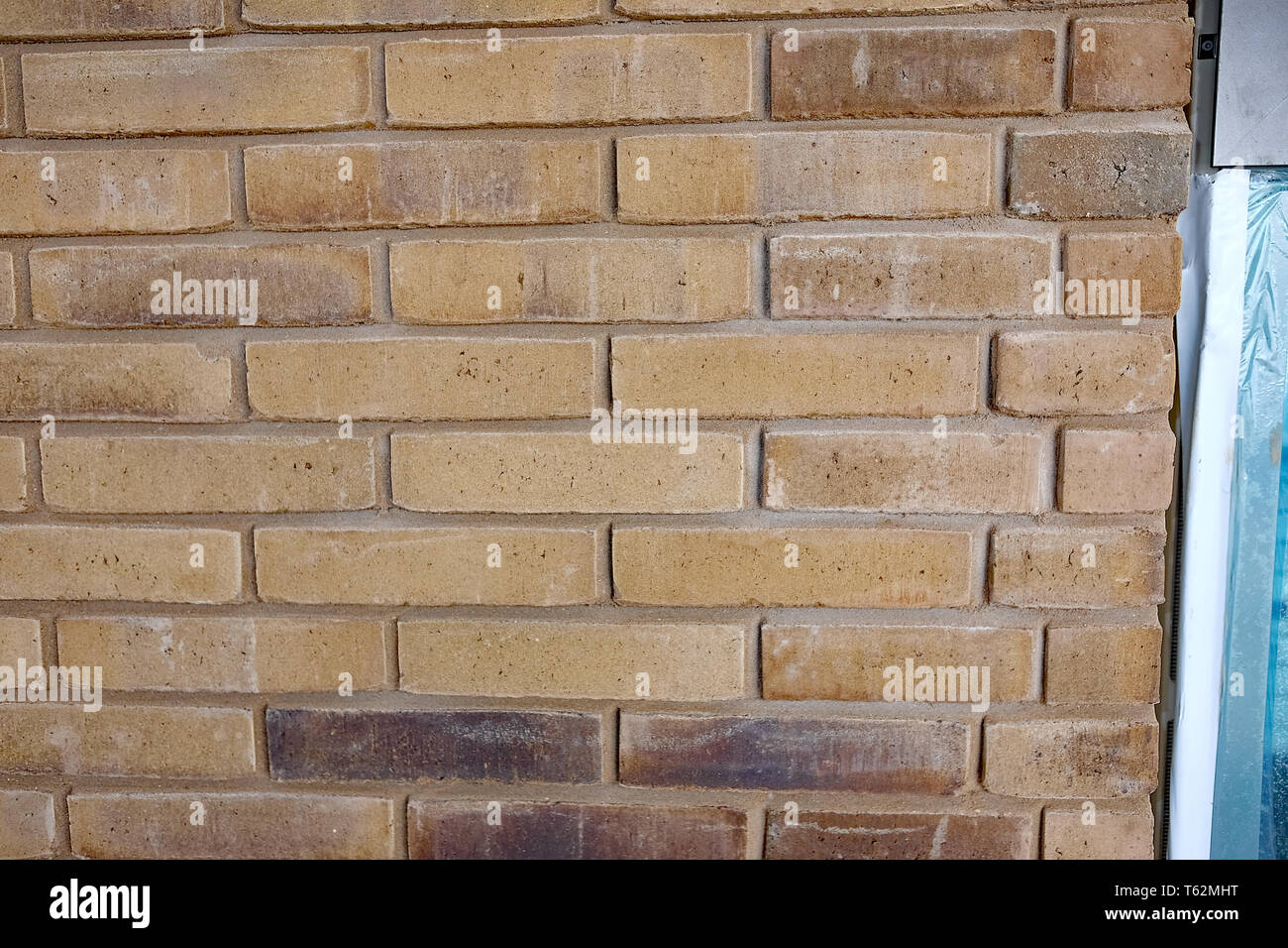 April 2019 - Uneven brickwork,with uneven sized bricks. Stock Photo