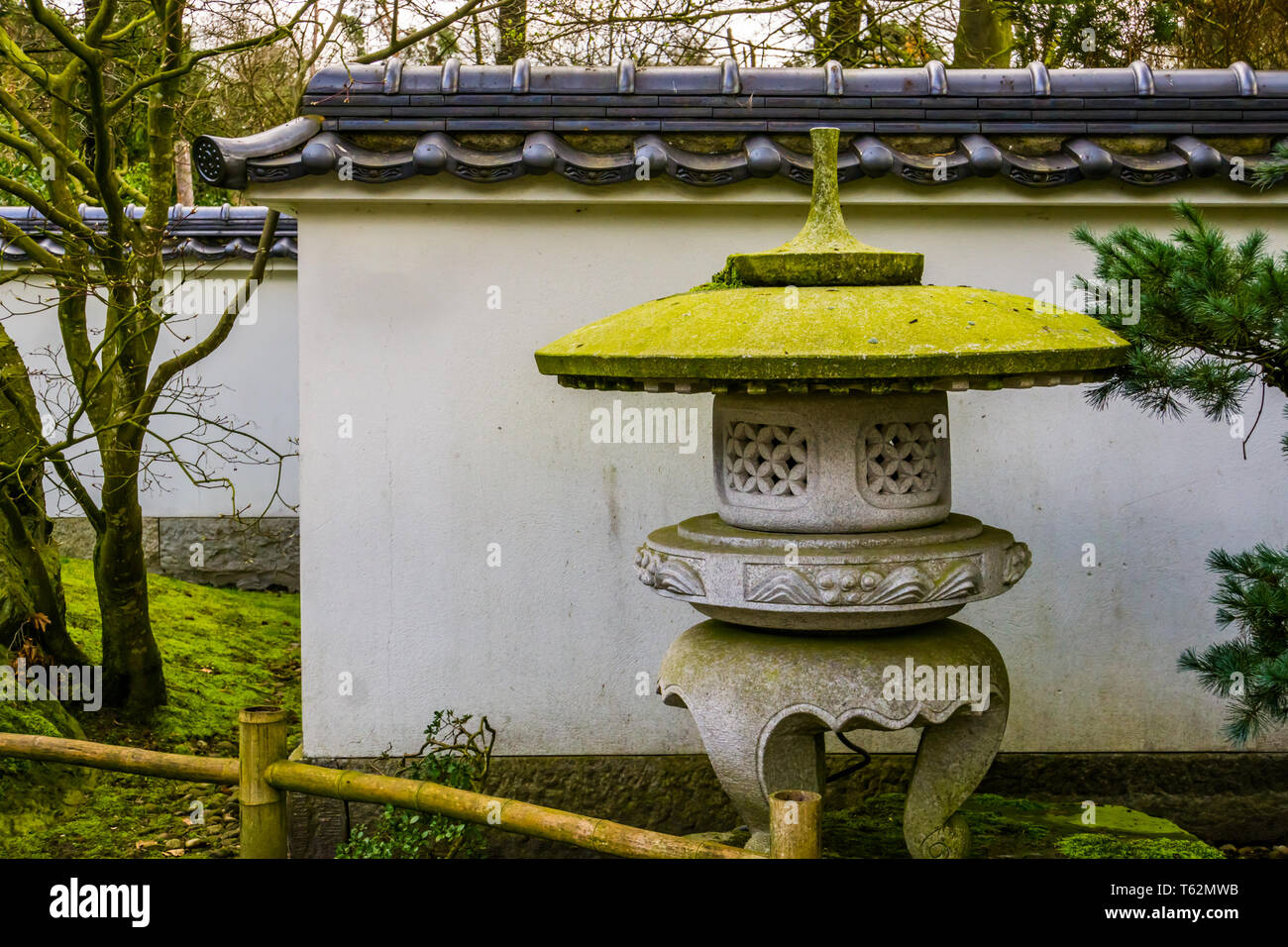 japanese stone tower in a Asian garden, Traditional garden architecture Stock Photo