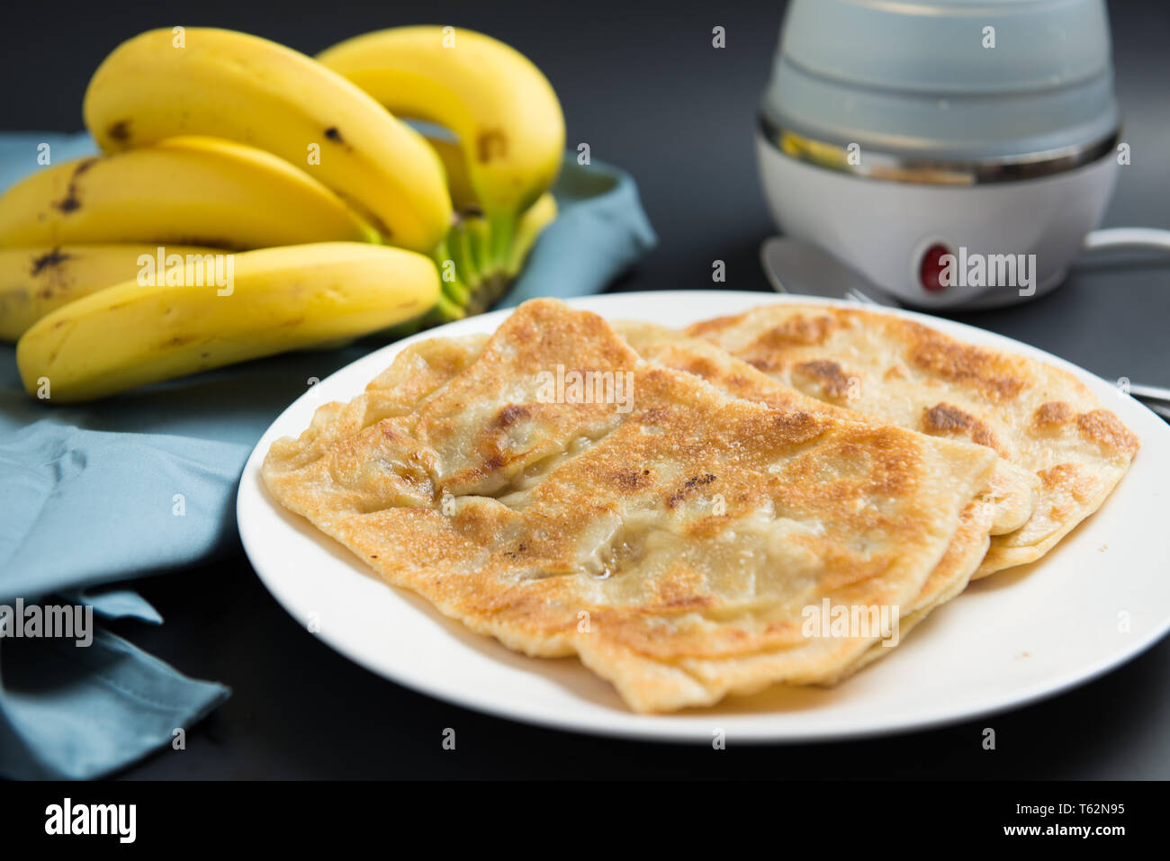 Indian breakfast banana paratha or pancake Stock Photo