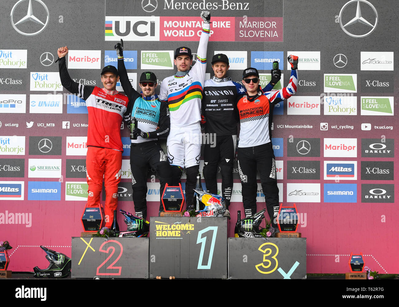 From left to right, fourth Charlie Harrison of United States, second Danny Hart of Great Britain, first Loic Bruni of France,  third Troy Brosnan and fifth Matt Walker of Great Britain are seen on the podium after the UCI Mountain Bike World Cup Finals in Maribor. Stock Photo