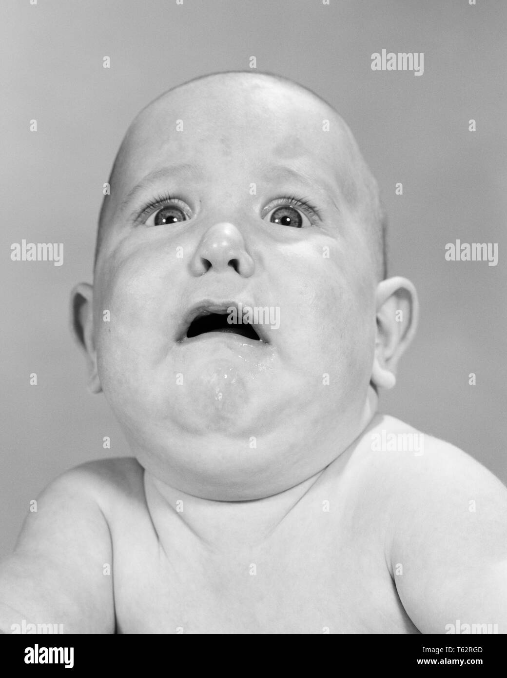 1960s CHUBBY BABY LOOKING UP ABOUT TO CRY AFRAID - b22281 HAR001 HARS B&W  SADNESS HUMOROUS HEAD AND SHOULDERS DISCOVERY COMICAL UP TERROR COMEDY  DREAD BABY BOY EMOTION EMOTIONAL EMOTIONS JUVENILES LOOKING