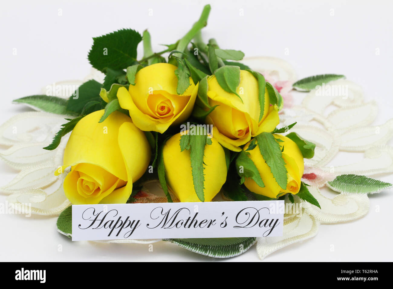 Happy Mothers day card with bunch of yellow tulips on white background Stock Photo
