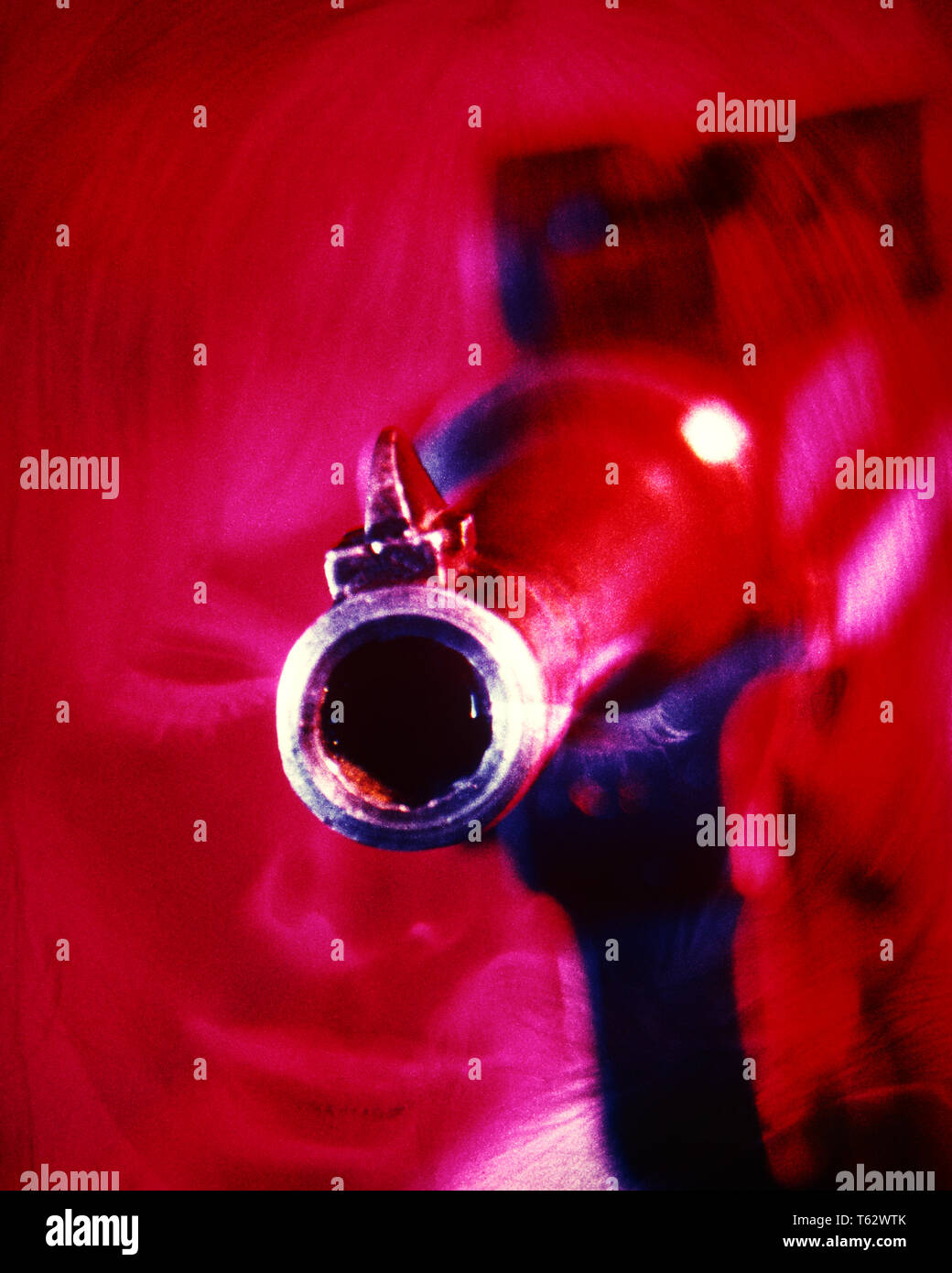 1970s MUZZLE OF GERMAN LUGER AUTOMATIC PISTOL GUN POINTED AT THE CAMERA RED OVERLAY OF WOMAN’S FACE DANGER  - kg5895 PHT001 HARS SYMBOLS WOMAN'S DANGEROUS DEATH AUTOMATIC POWERFUL POINTED AT OF THE HOLDUP SPIES CONCEPT CONCEPTUAL MUZZLE STILL LIFE CLOSE-UP ESCAPE OVERLAY VIEWER SYMBOLIC CONCEPTS FIREARM FIREARMS GRAPHIC DESIGN LUGER MAYHEM MURDER PISTOL SEMIAUTOMATIC THREAT THREATENING TONE ASSAULT OLD FASHIONED REPRESENTATION Stock Photo