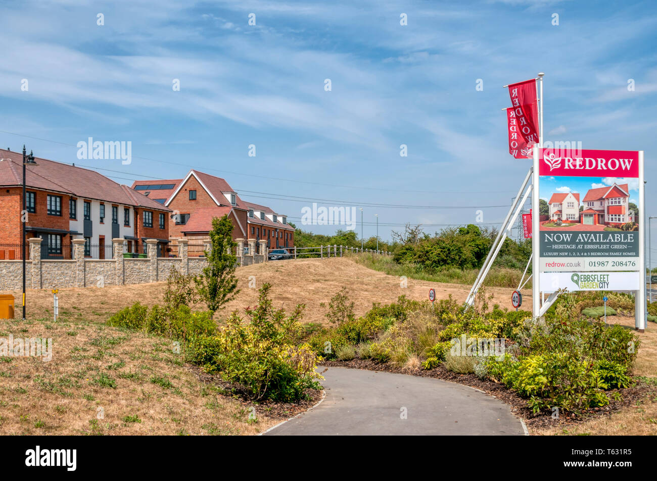 A sign advertises Heritage Homes by Redrow at Ebbsfleet Green, part of Ebbsfleet Garden City in Kent. Stock Photo