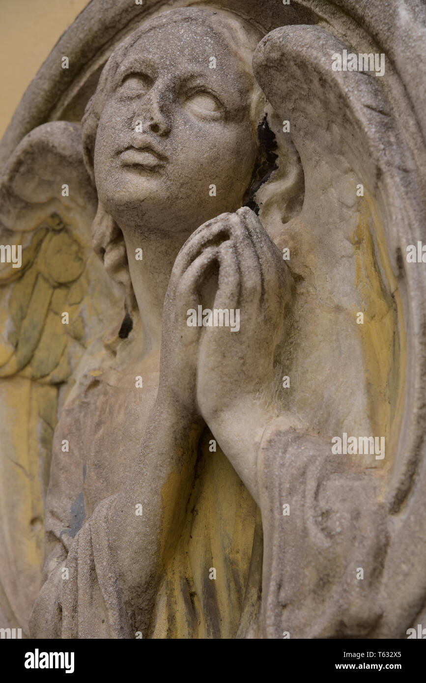 Angelic stone carving inside the courtyard of the Church of SS Peter and Paul, Beyoglu, Istanbul, Turkey, Europe. Stock Photo
