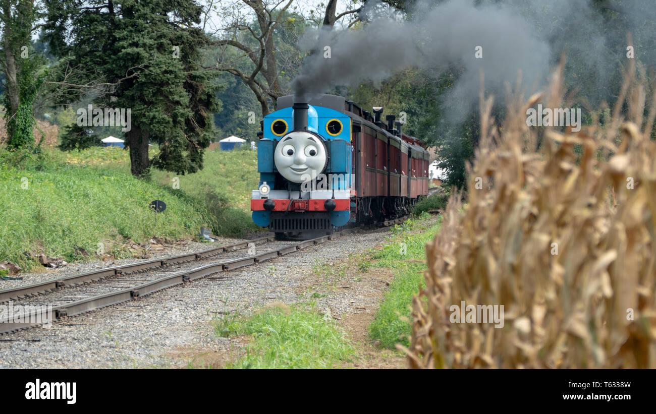 Strasburg, Pennsylvania - September 2018: Thomas the Train in Amish Countryside Puffing Away Stock Photo